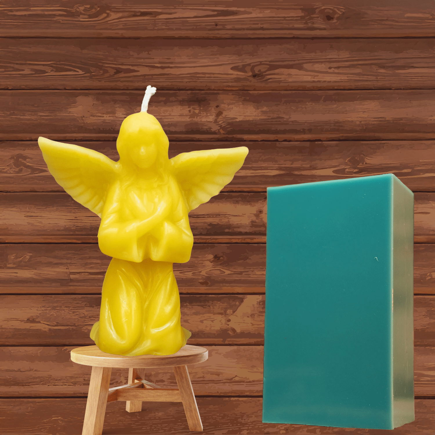 Small detailed angel candle showing wings and gown from mold